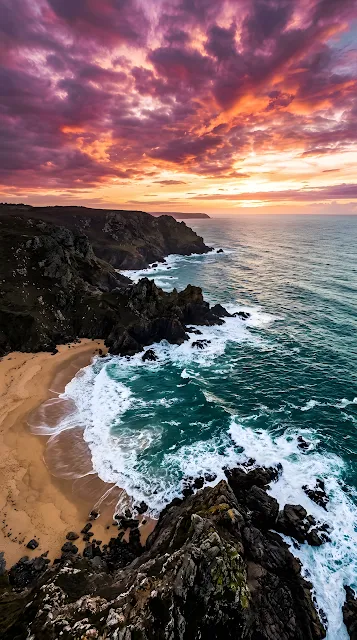 Aerial Coastline With Crashing Waves And Vibrant Purple Sunset - Free mobile Wallpaper