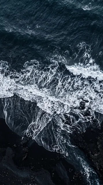 Aerial Drone Photography of Dark Blue Sea and Foaming White Waves - Free 4K & 8K mobile Wallpaper
