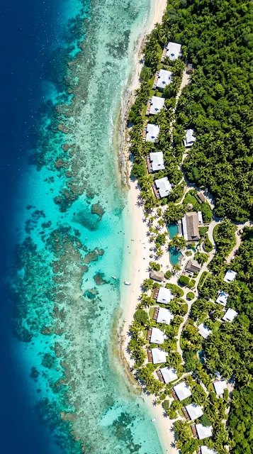 Aerial Drone Photography of a Tropical Coastline with Clear Turquoise Water - Free 4K & 8K mobile Wallpaper