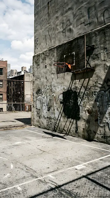 Cinematic Photo of an Urban Basketball Court with High Contrast Shadows and Light - Free mobile Wallpaper