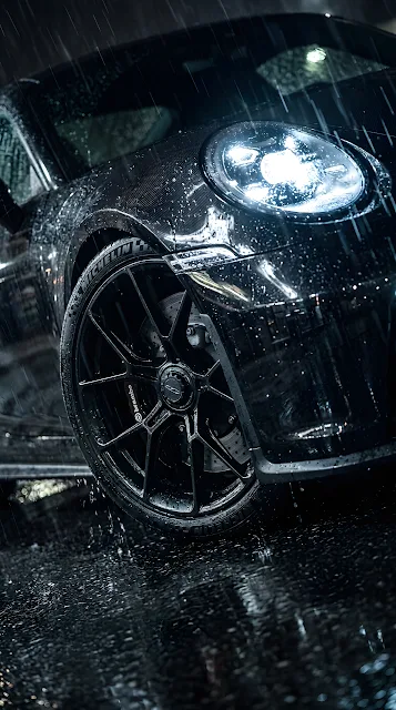 Close-up of a Black BMW Car parked in Heavy Rain - Free mobile Wallpaper