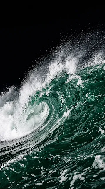 Close-up of a Dark Emerald Ocean Wave Cresting with White Spray - Free 4K & 8K mobile Wallpaper