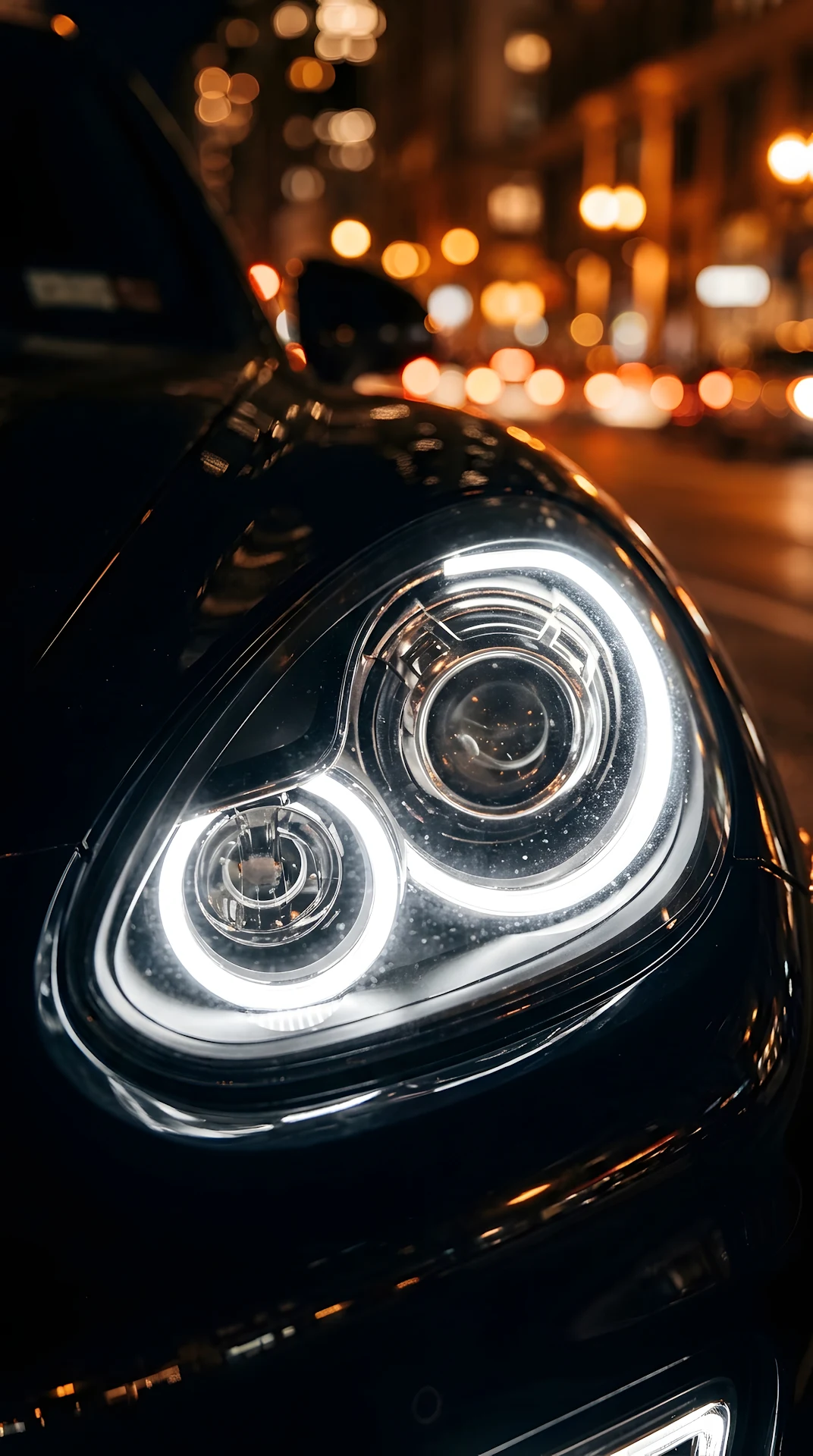 Close-up of Modern Luxury Car Headlight with Night Bokeh - Free 4K mobile Wallpaper