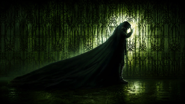 Doctor Doom in profile wearing a long trailing cloak in front of a glowing green ornate wall.
