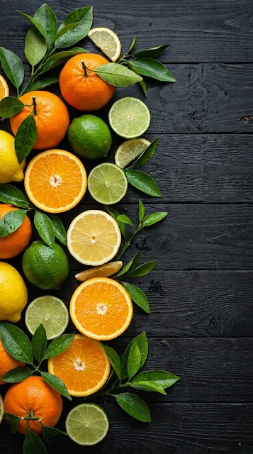 Fresh Oranges and Limes Flatlay on Dark Wood - Free 4K & 8K mobile Wallpaper