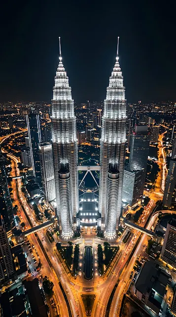 High-Angle Aerial Night View of the Petronas Twin Towers - Free mobile Wallpaper