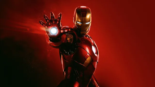 Iron Man in red and gold armor with glowing eyes and chest reactor, aiming a white repulsor hand beam on a red background.