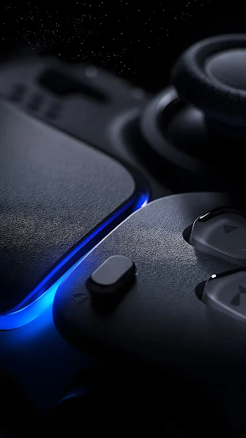 Close-up macro detail of a matte black gaming controller featuring a glowing blue LED accent strip and textured grip surface.