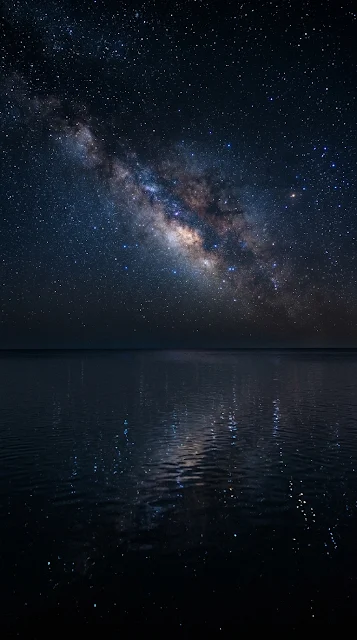 Minimalist Calm Ocean Under Dense Starry Night Sky - Free 4K & 8K mobile Wallpaper