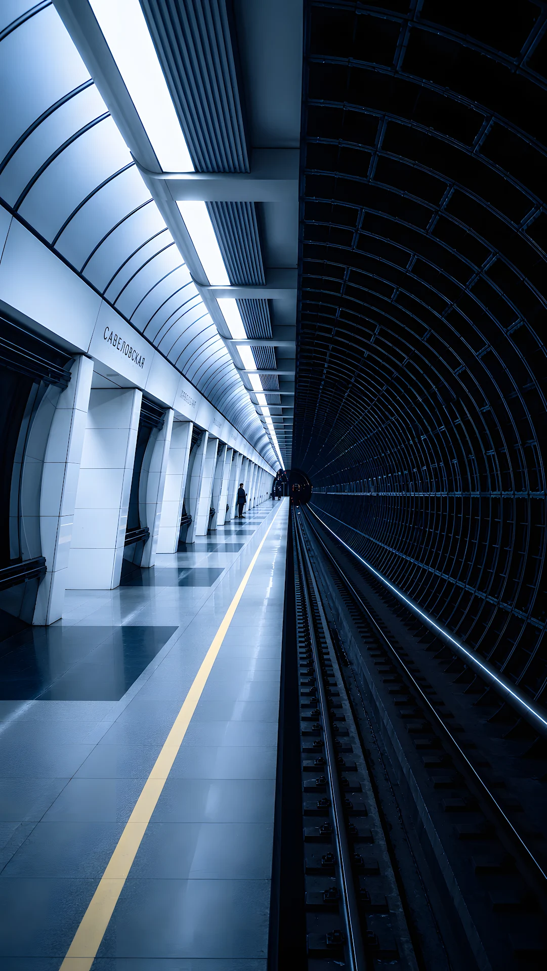 Minimalist subway platform displaying contrast split between light and dark architecture - Free 4K mobile Wallpaper