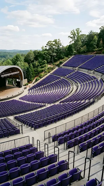 Modern Outdoor Amphitheater with Rows of Deep Purple Seating - Free mobile Wallpaper