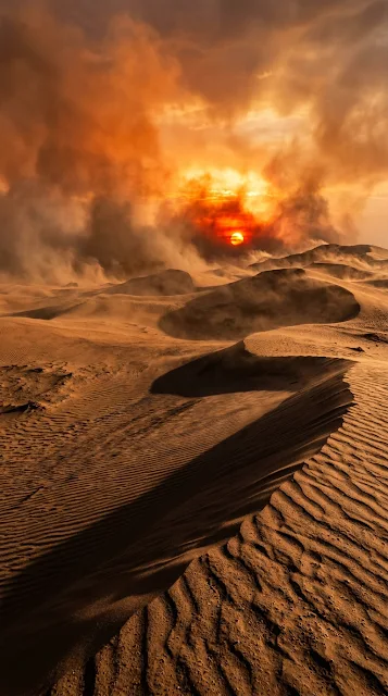 Photorealistic Desert Sunset with Fiery Sun and Swirling Sand Clouds - Free 4K & 8K mobile Wallpaper