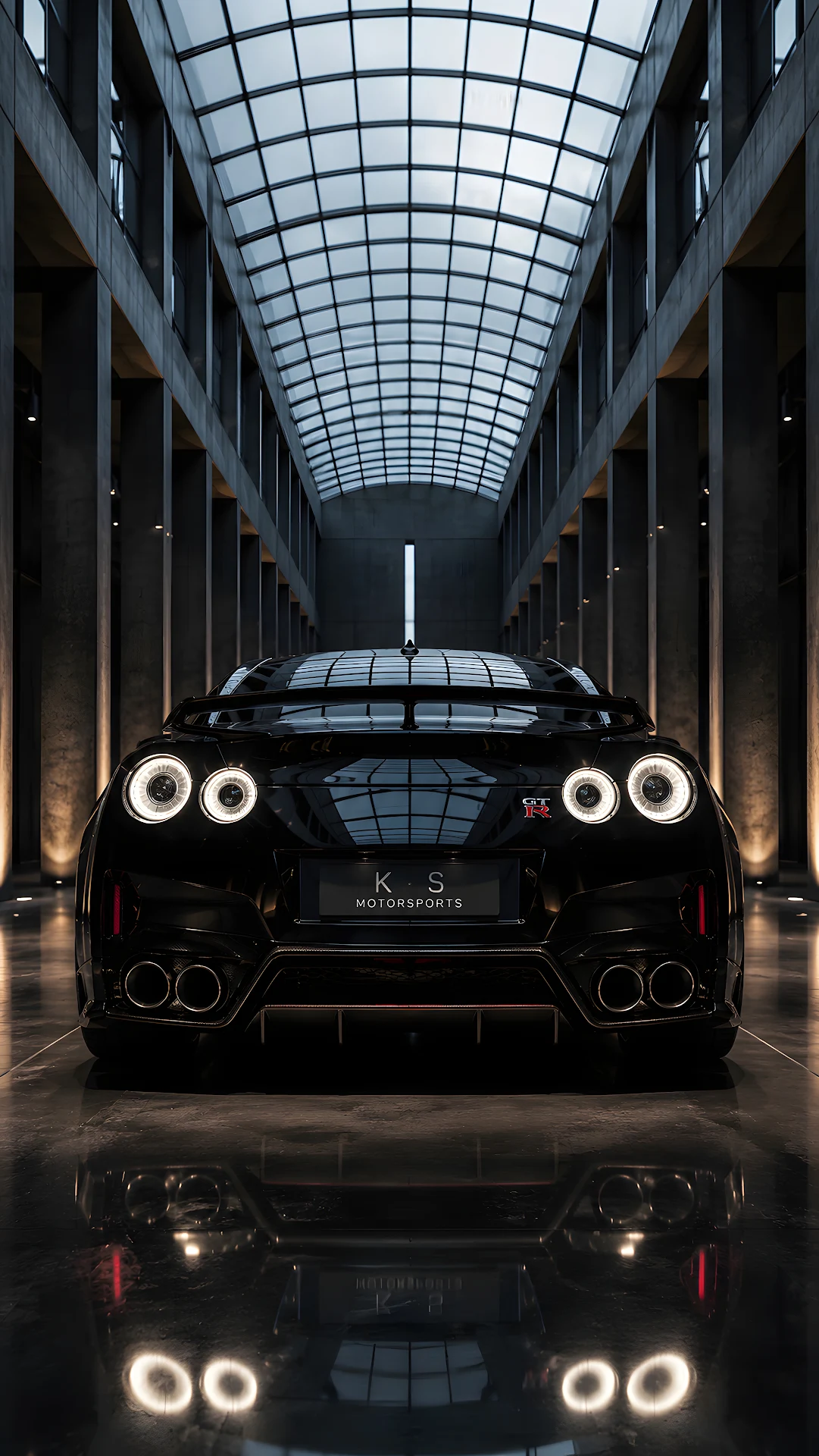 Rear view of sleek black sports car parked in modern hall - Free 4K mobile Wallpaper