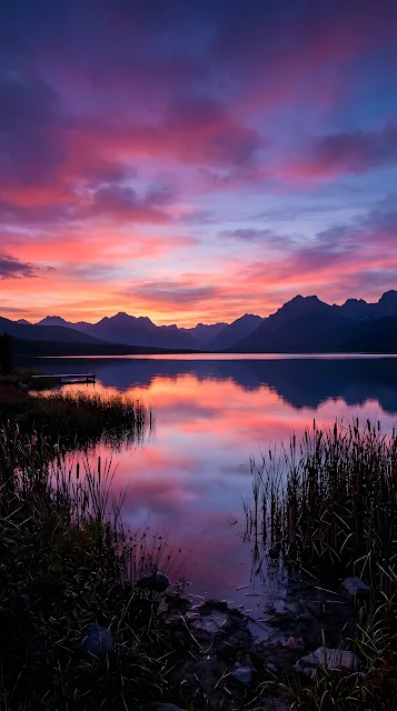 Serene Lakeside Sunset with Vibrant Purple and Pink Sky - Free mobile Wallpaper