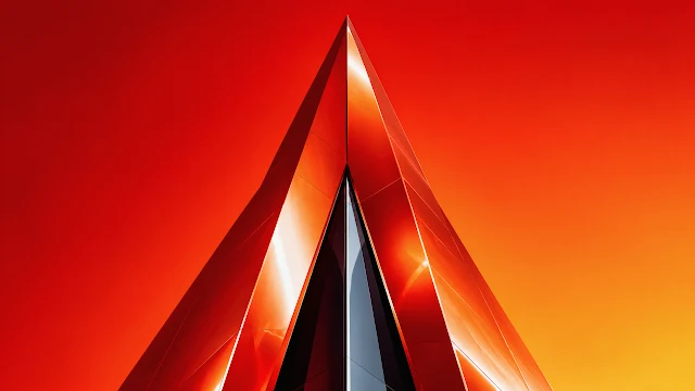 A sharp, modern triangular metallic architectural spire in vibrant red and copper tones set against a bright orange gradient sky.
