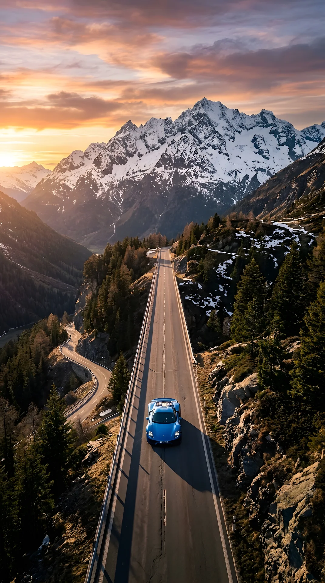 Top-Down Aerial View of a Blue Car on a Long Winding Mountain Road - Free 4K mobile Wallpaper